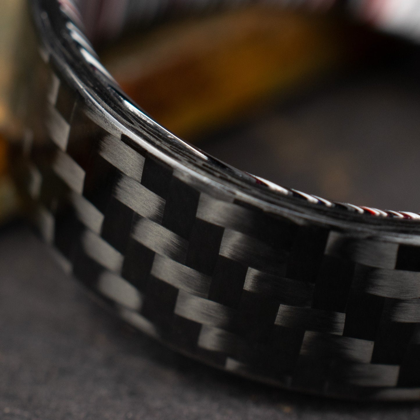 1k Twill Carbon Fiber Ring Lined With Crosscut Fordite. Gloss Finish Carbon Fiber