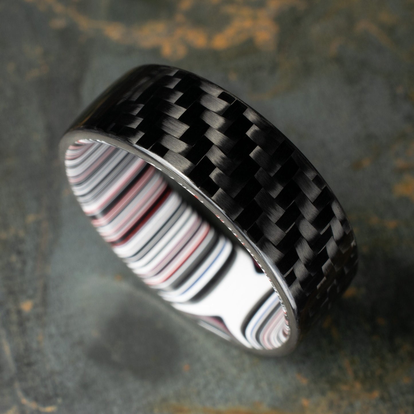 1k Twill Carbon Fiber Ring Lined With Crosscut Fordite. Gloss Finish Carbon Fiber