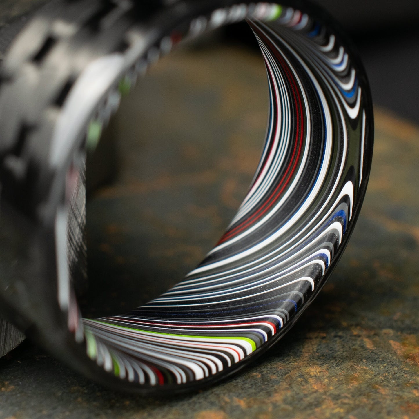 5HS Carbon Fiber Ring Lined With Tilted Premium Fordite