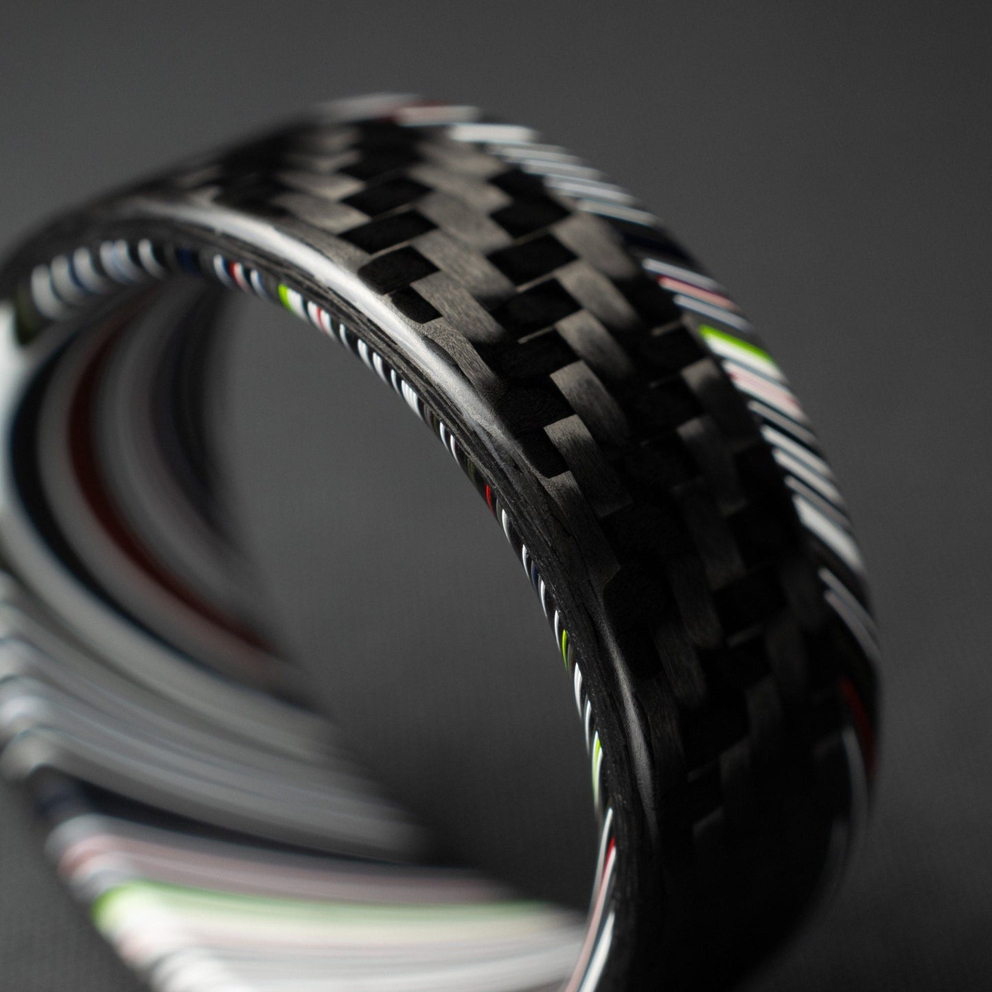 1k Twill Carbon Fiber Ring Lined With Tilted Premium Fordite In a Flipped Cuff Design