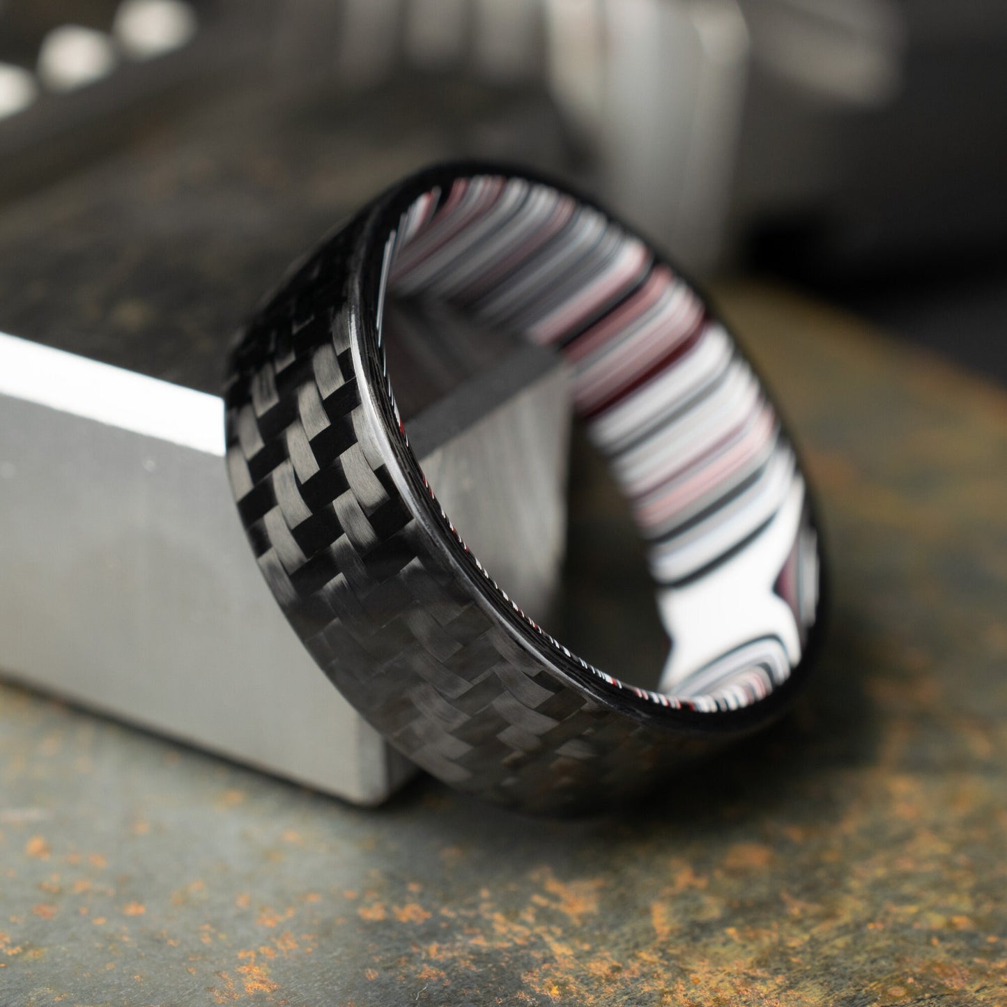1k Twill Carbon Fiber Ring Lined With Crosscut Fordite. Gloss Finish Carbon Fiber