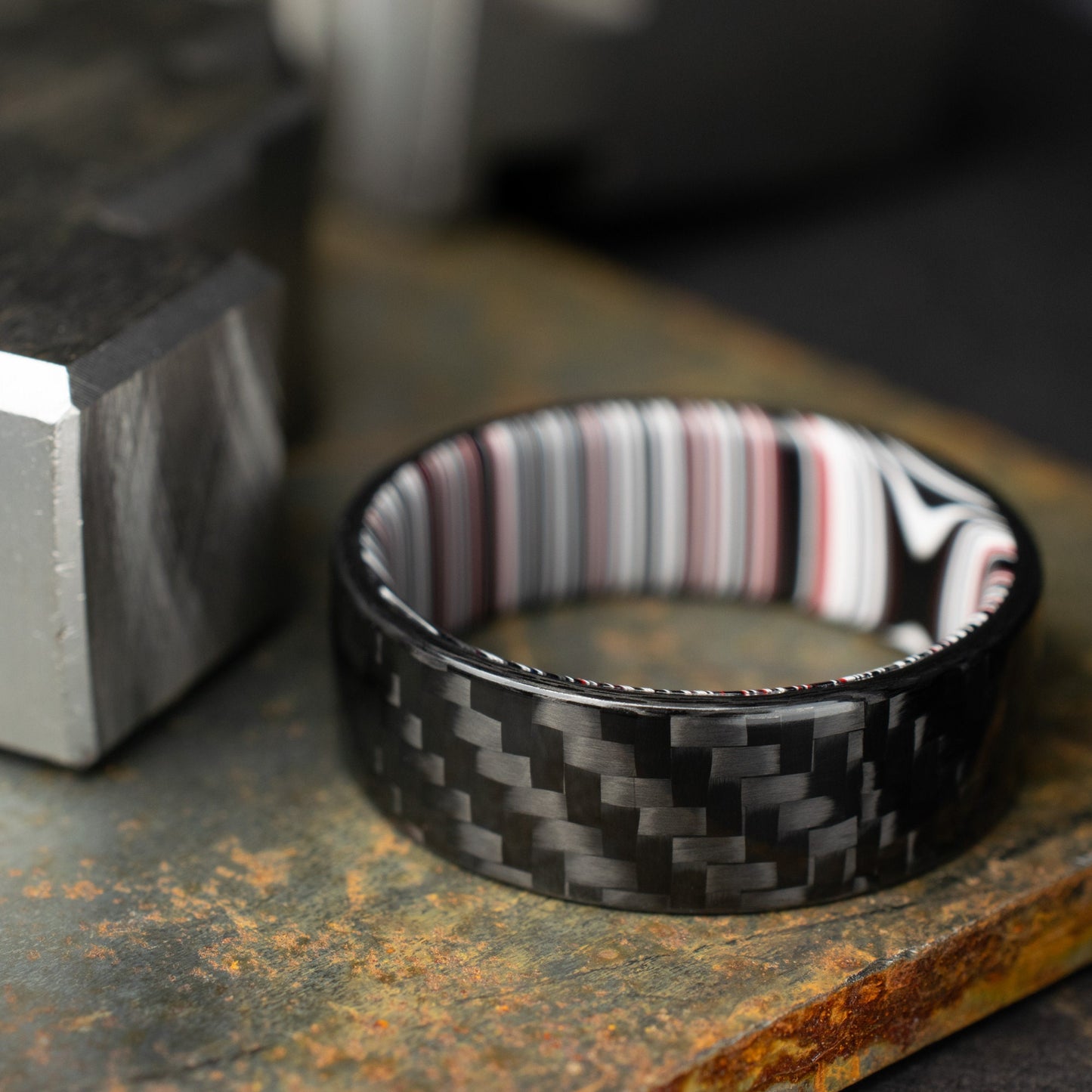 1k Twill Carbon Fiber Ring Lined With Crosscut Fordite. Gloss Finish Carbon Fiber