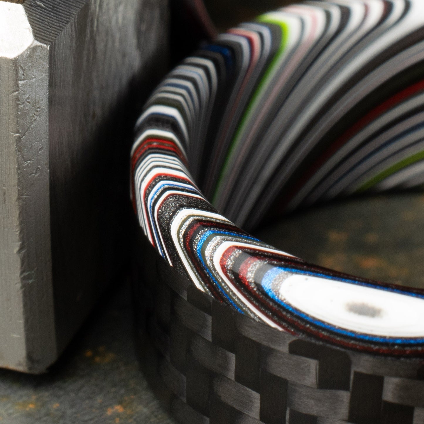 1k Twill Carbon Fiber Ring Lined With Tilted Premium Fordite In a Flipped Cuff Design