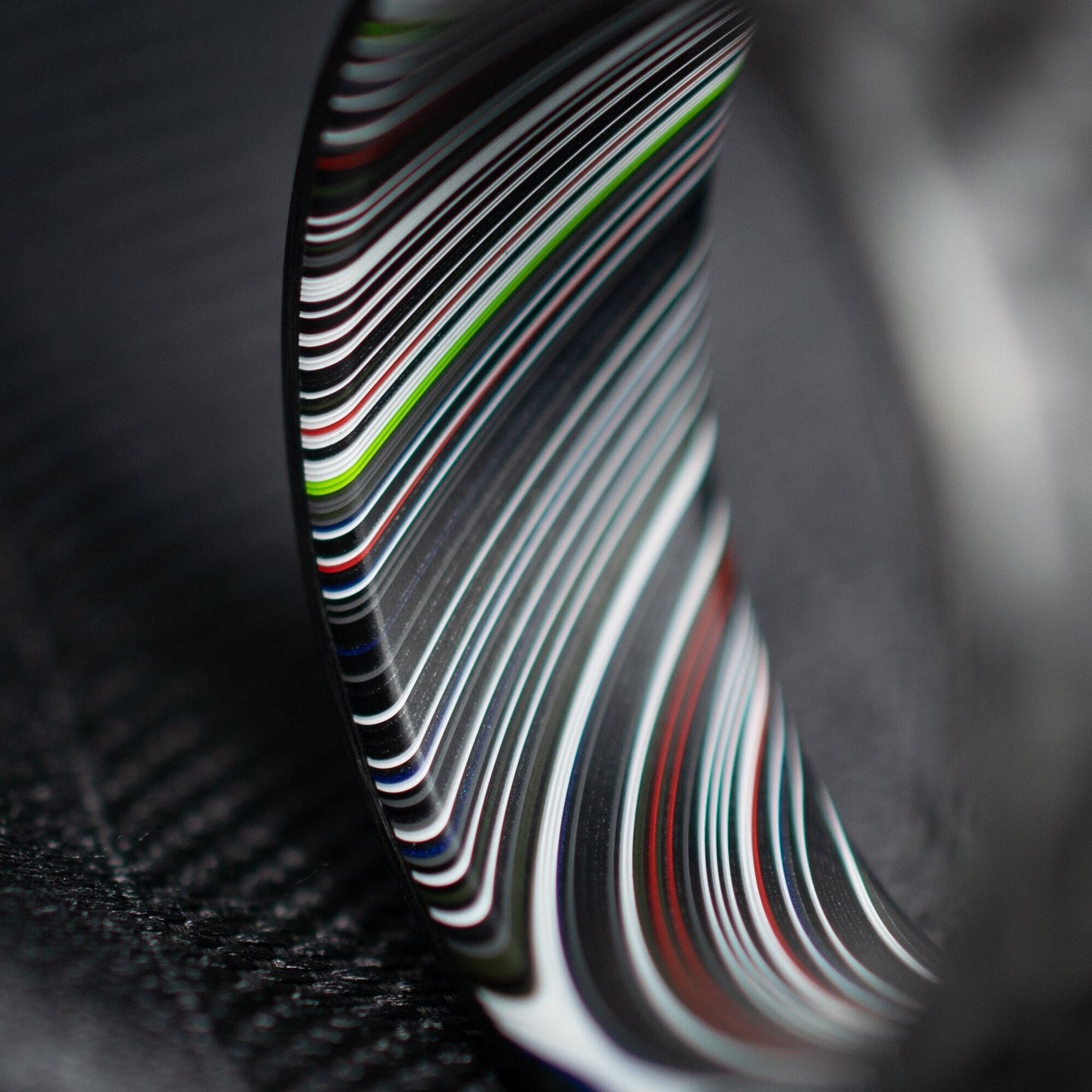 1k Twill Carbon Fiber Ring Lined With Tilted Premium Fordite In a Flipped Cuff Design