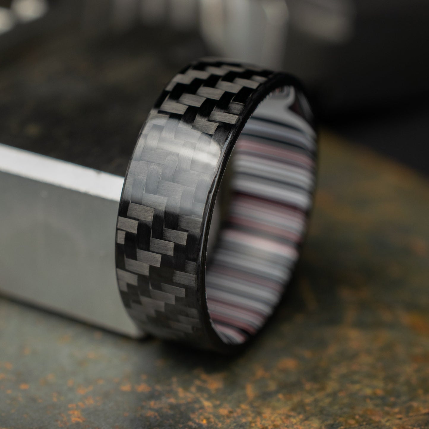 1k Twill Carbon Fiber Ring Lined With Crosscut Fordite. Gloss Finish Carbon Fiber