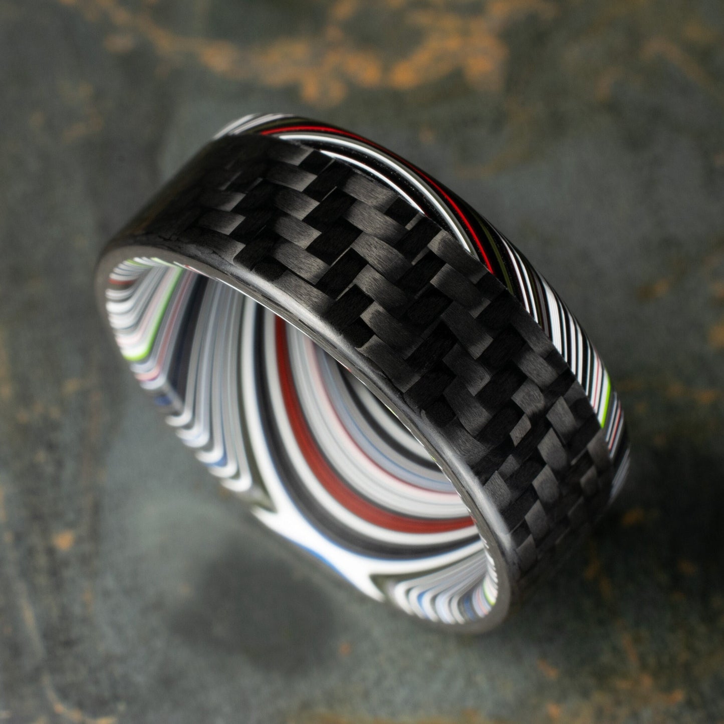 1k Twill Carbon Fiber Ring Lined With Tilted Premium Fordite In a Flipped Cuff Design