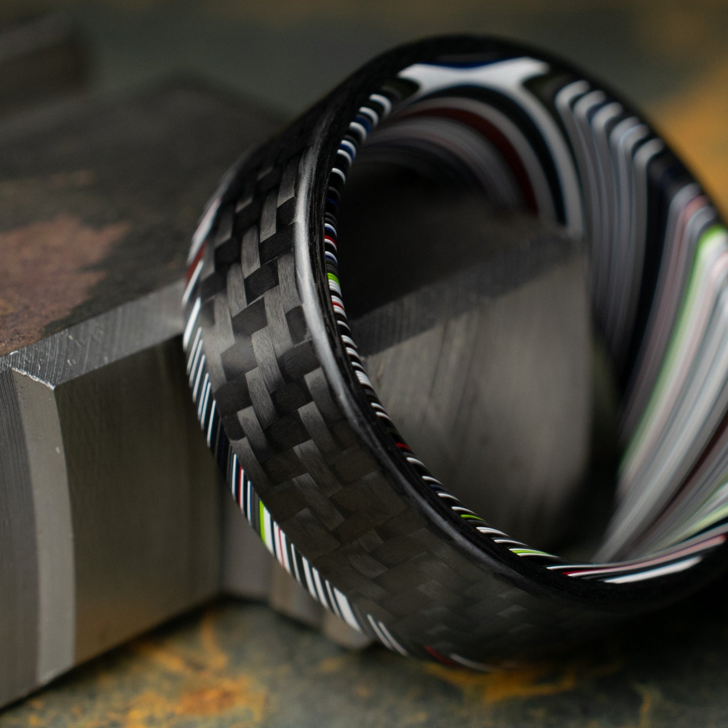 1k Twill Carbon Fiber Ring Lined With Tilted Premium Fordite In a Flipped Cuff Design