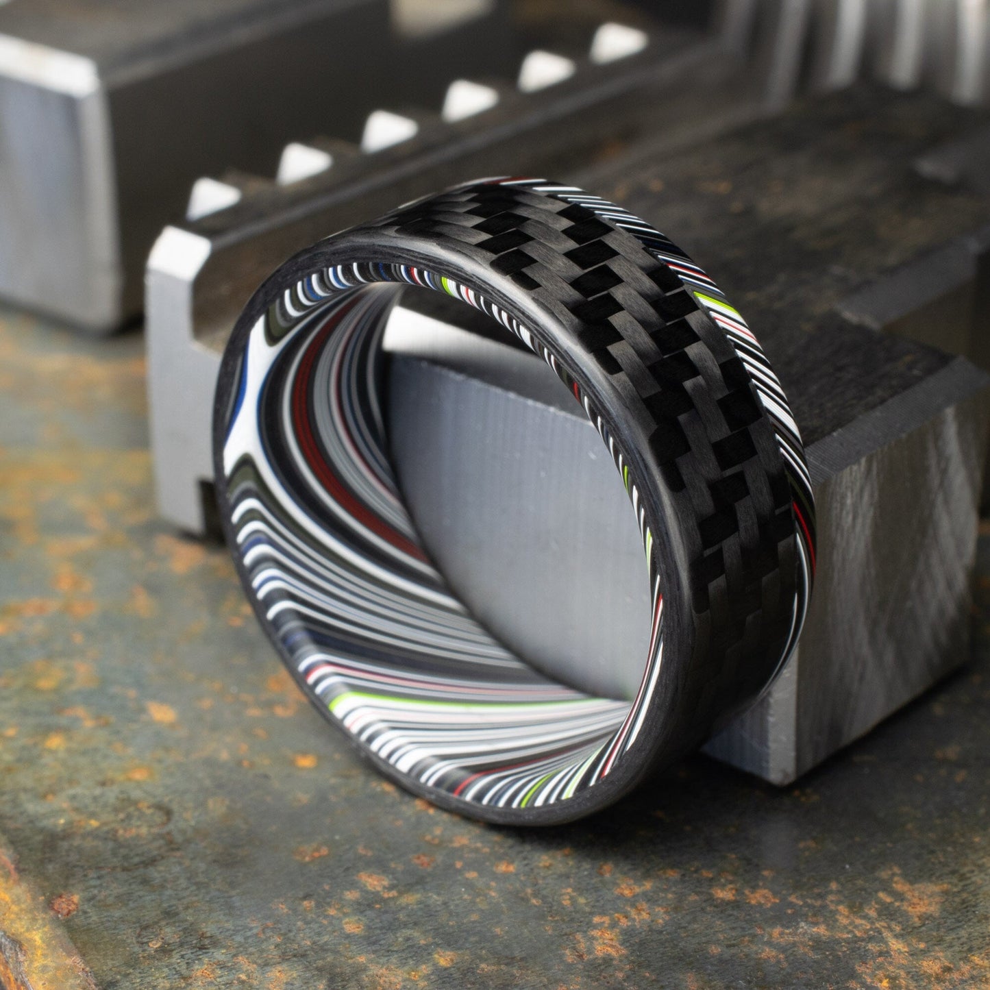 1k Twill Carbon Fiber Ring Lined With Tilted Premium Fordite In a Flipped Cuff Design