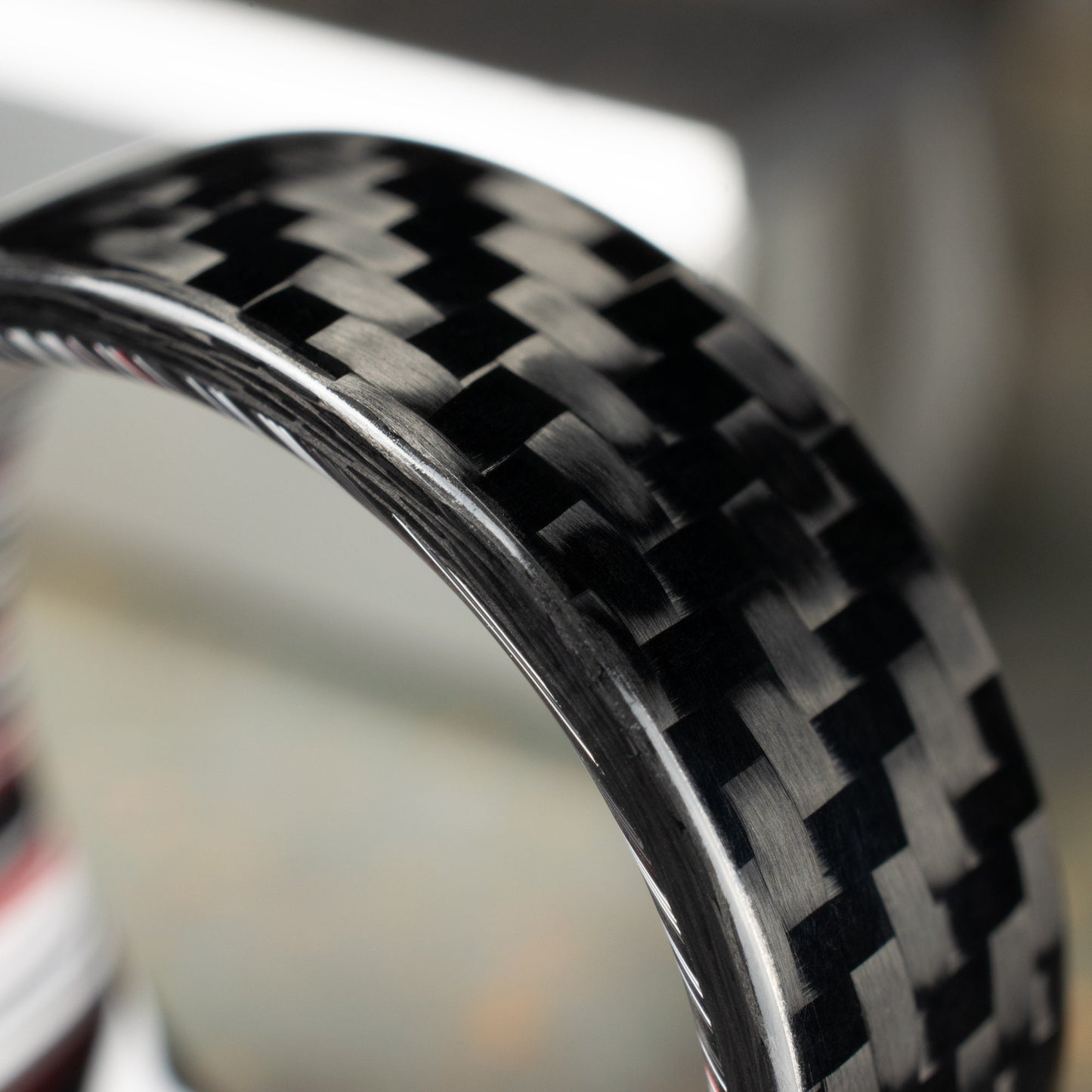 1k Twill Carbon Fiber Ring Lined With Crosscut Fordite. Gloss Finish Carbon Fiber