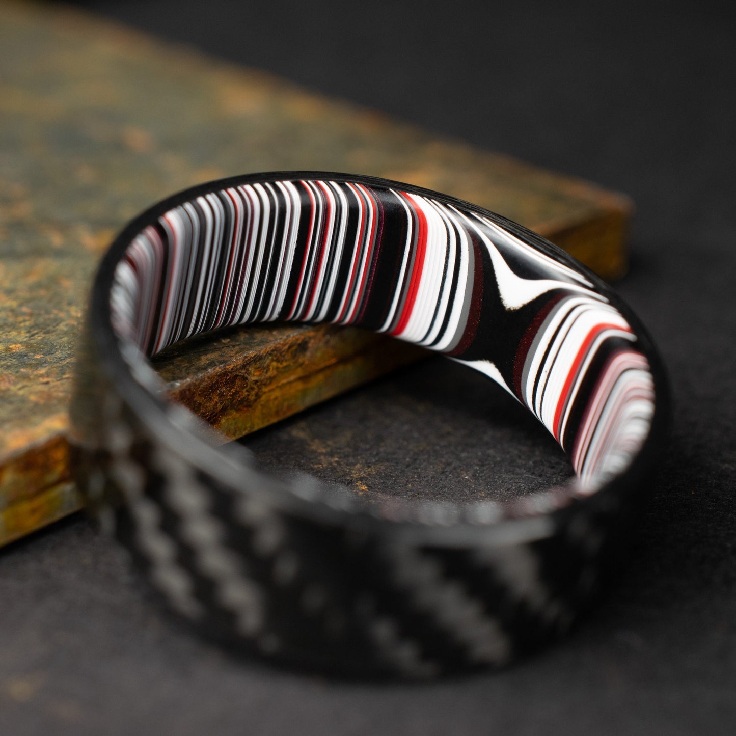 1k Twill Carbon Fiber Ring Lined With Crosscut Fordite. Gloss Finish Carbon Fiber