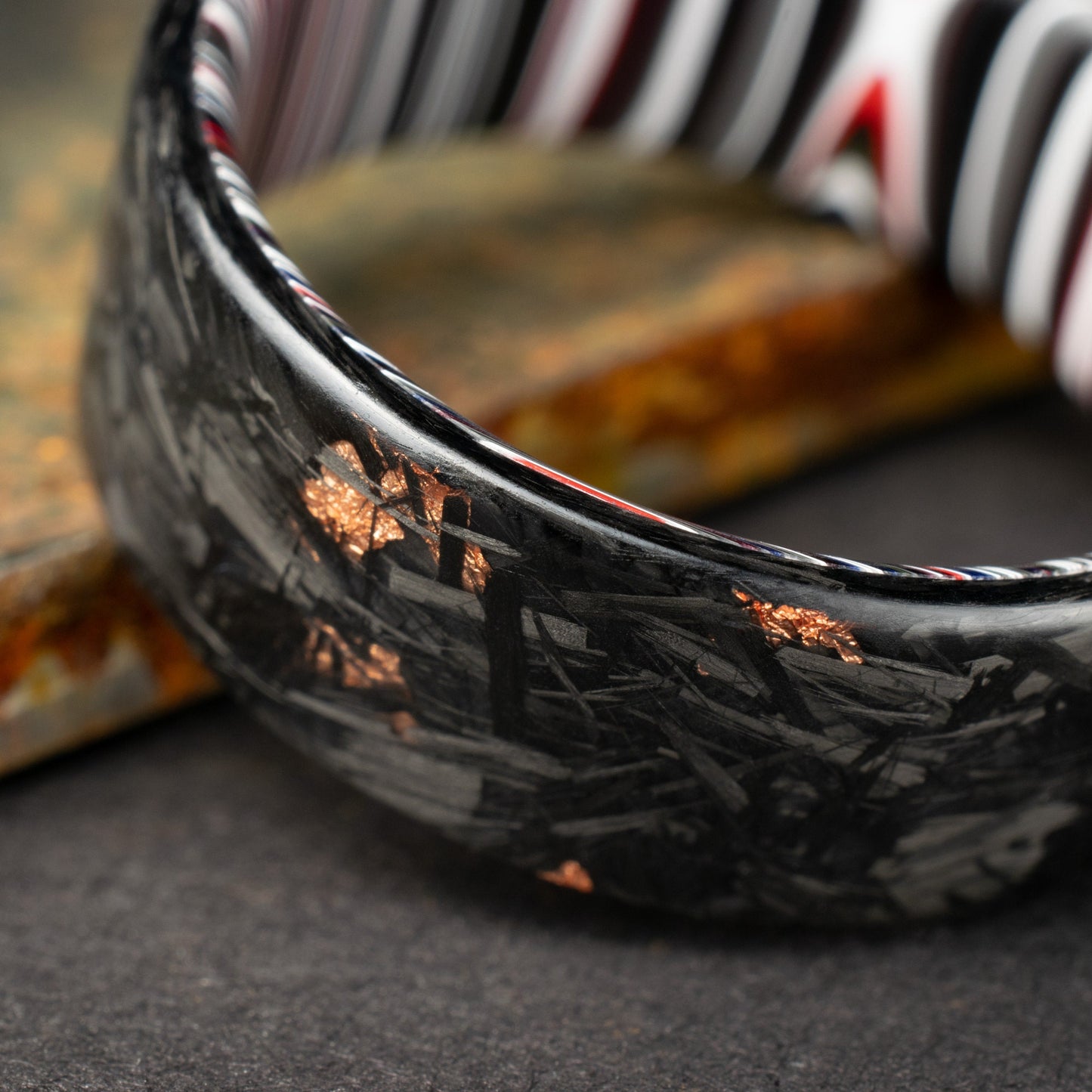 Men's Wedding Band, Copper Chopped Carbon Fiber, Lined With Crosscut Fordite. Matte Finish Carbon Fiber.