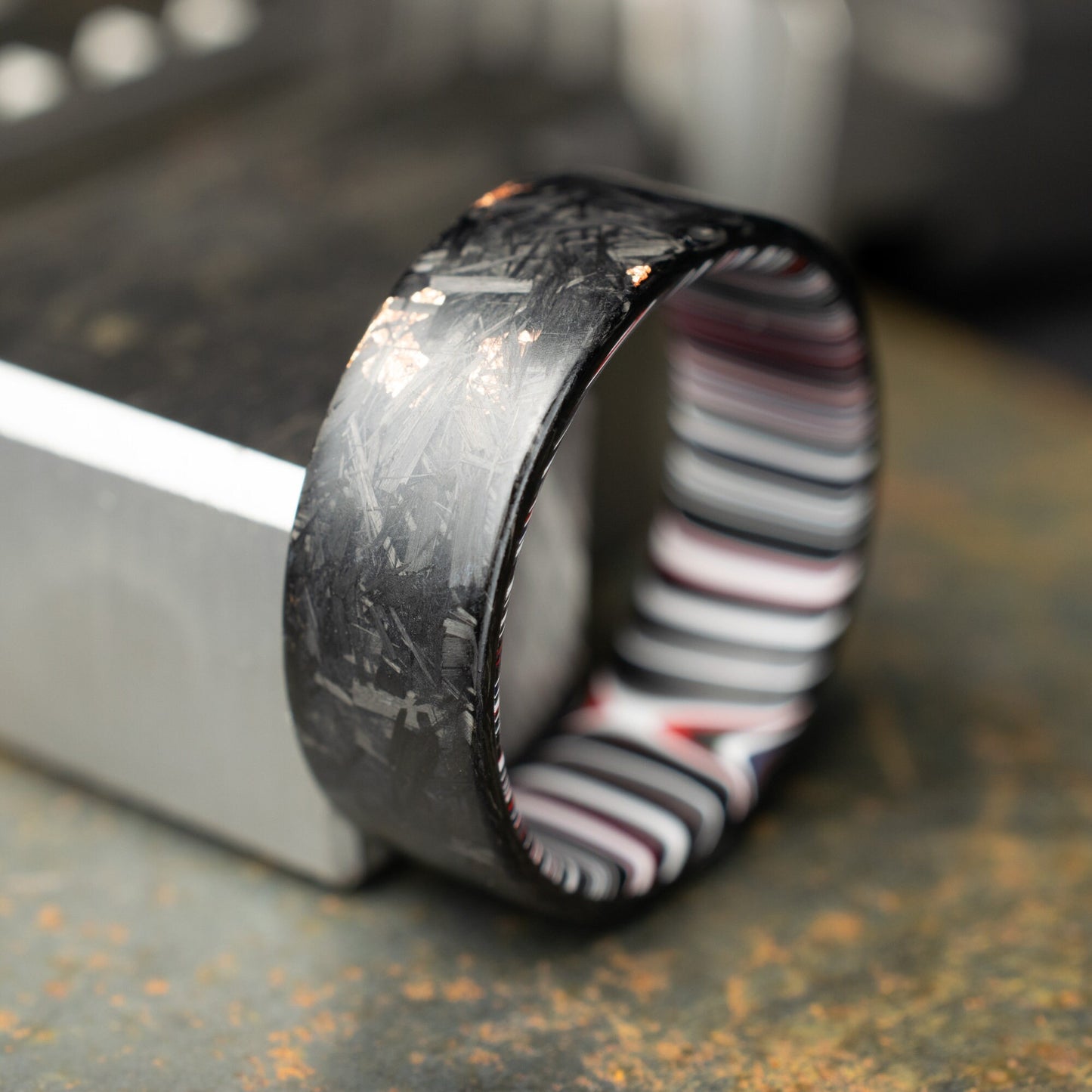 Men's Wedding Band, Copper Chopped Carbon Fiber, Lined With Crosscut Fordite. Matte Finish Carbon Fiber.