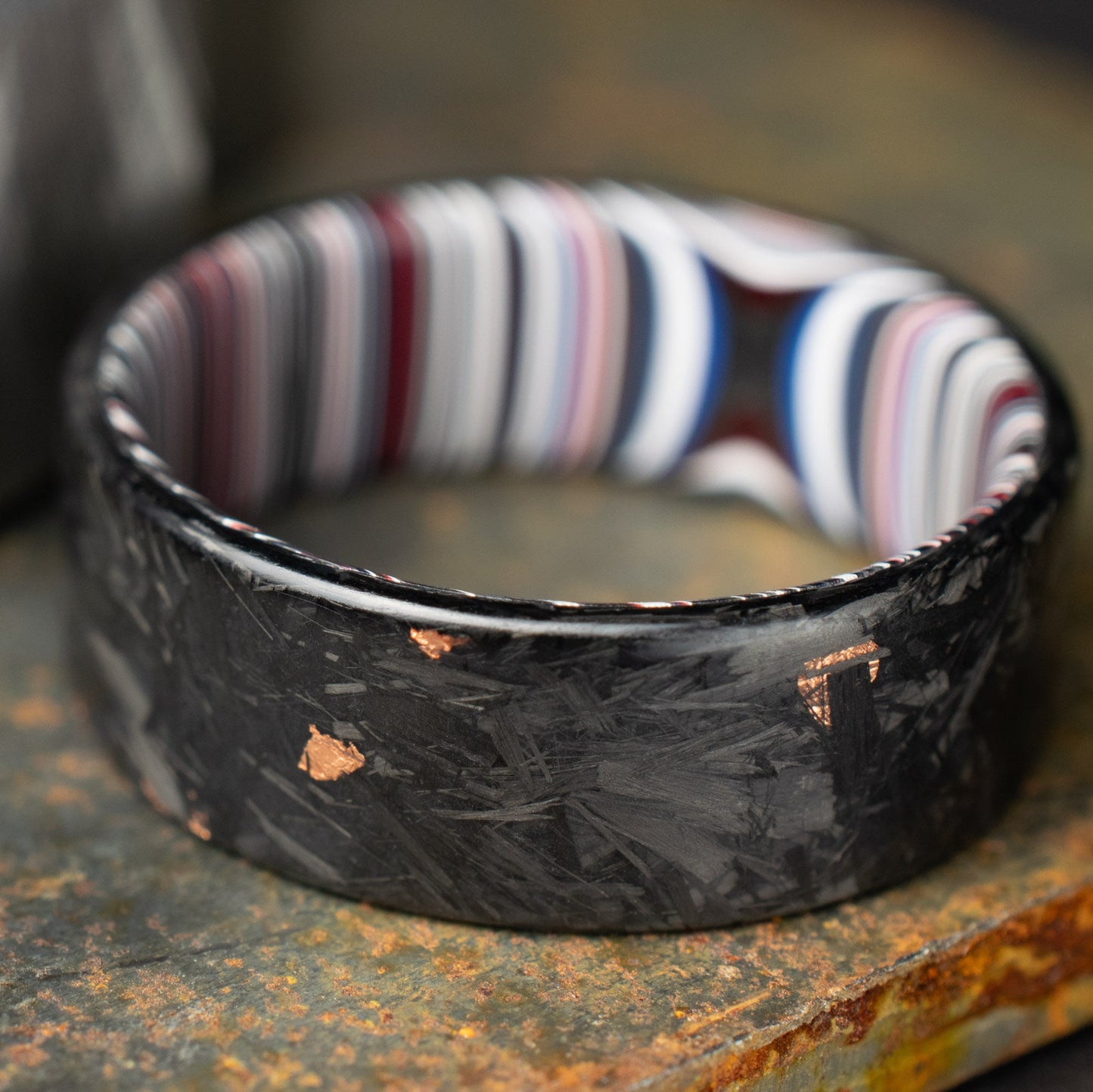 Men's Wedding Band, Copper Chopped Carbon Fiber, Lined With Crosscut Fordite. Matte Finish Carbon Fiber.