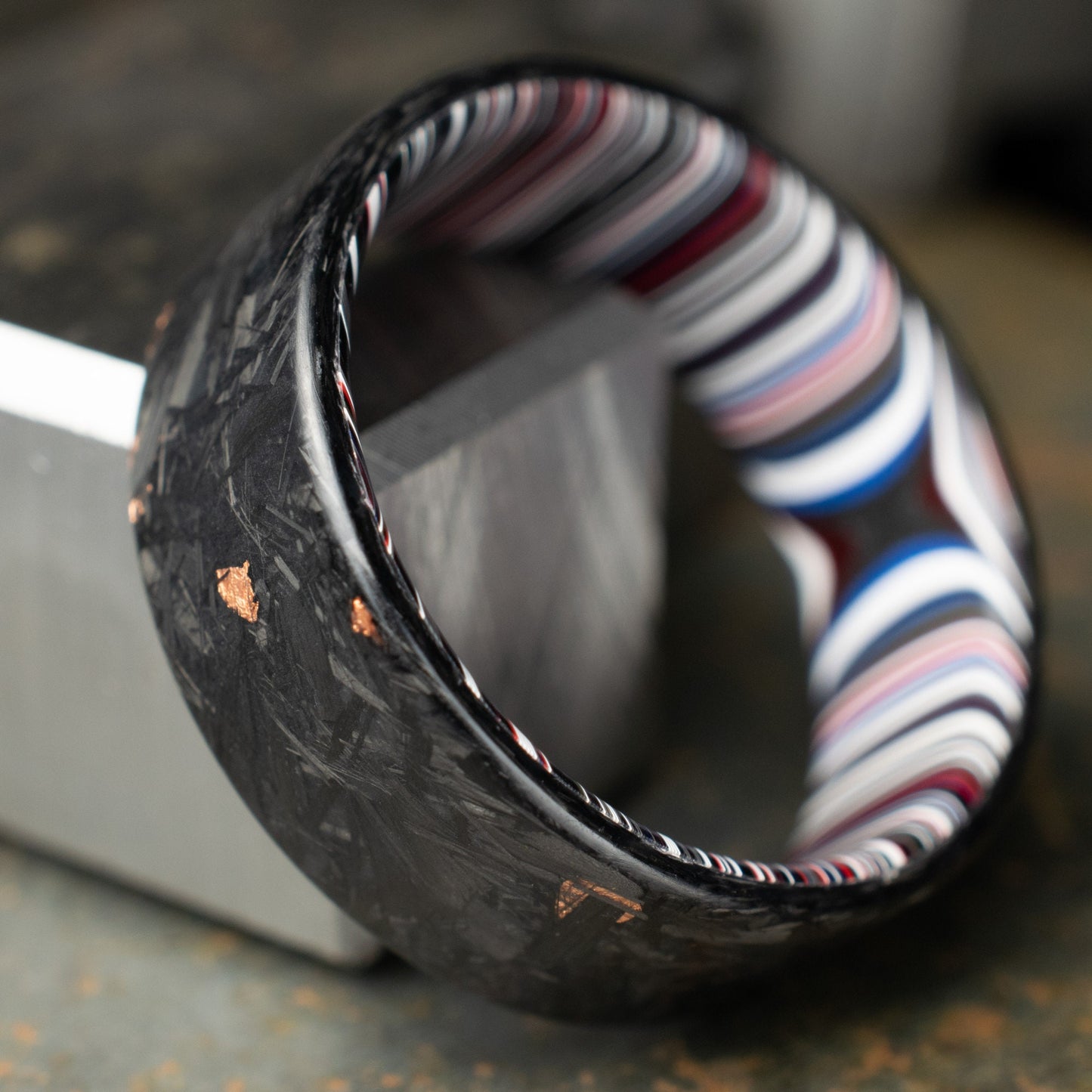 Men's Wedding Band, Copper Chopped Carbon Fiber, Lined With Crosscut Fordite. Matte Finish Carbon Fiber.