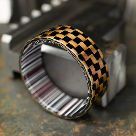 Checkered Zylon/Carbon Fiber Ring Lined With Cross Cut Fordite. Gloss Finish Zylon/Carbon Fiber. Men's Wedding Band.
