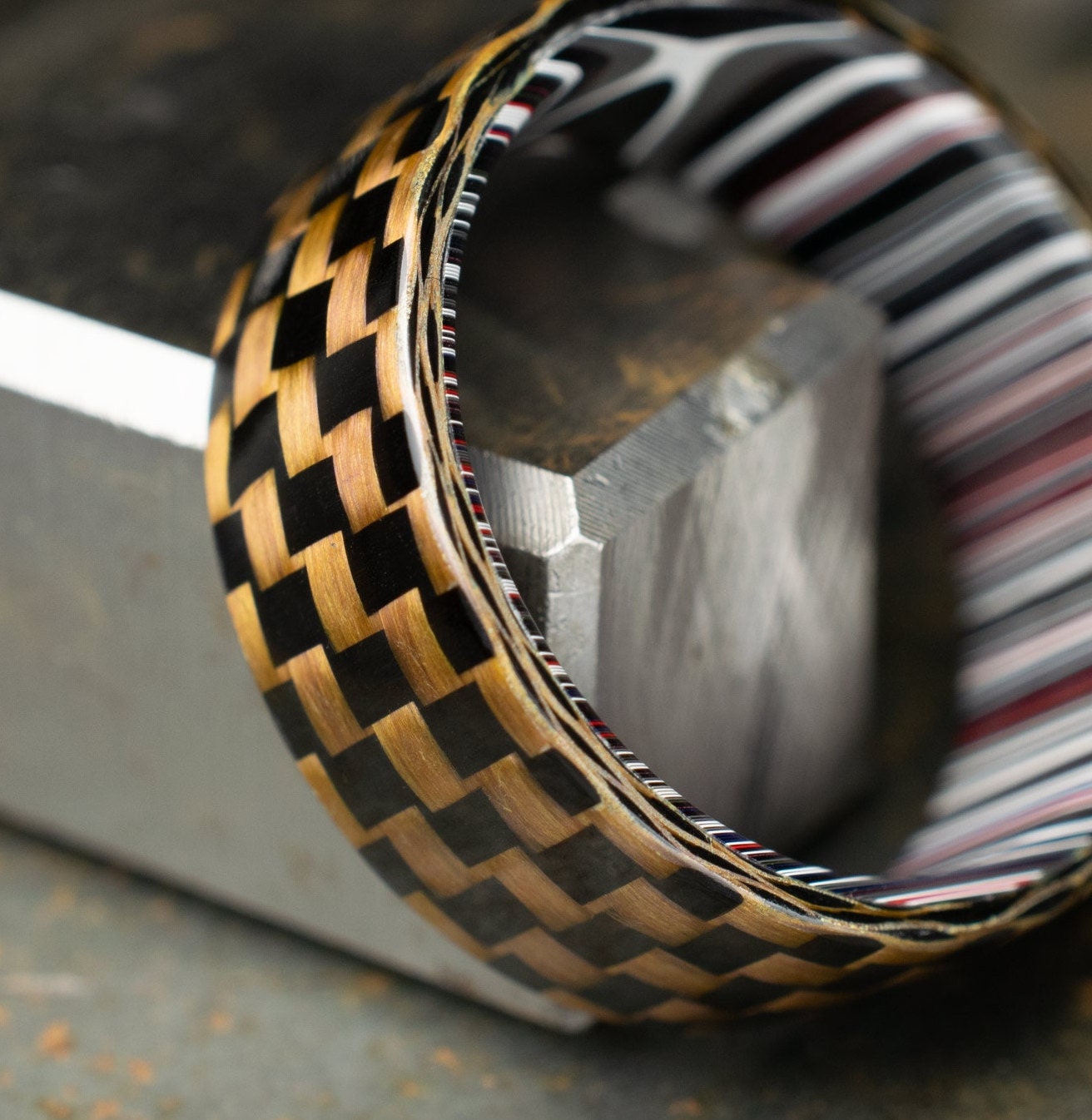 Checkered Zylon/Carbon Fiber Ring Lined With Cross Cut Fordite. Gloss Finish Zylon/Carbon Fiber. Men's Wedding Band.