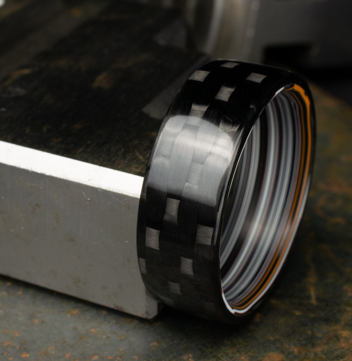 Men's Wedding Band. 5HS Carbon Fiber Ring Lined With Straight Cut Fordite. Gloss Finish Carbon Fiber. Black Ring.