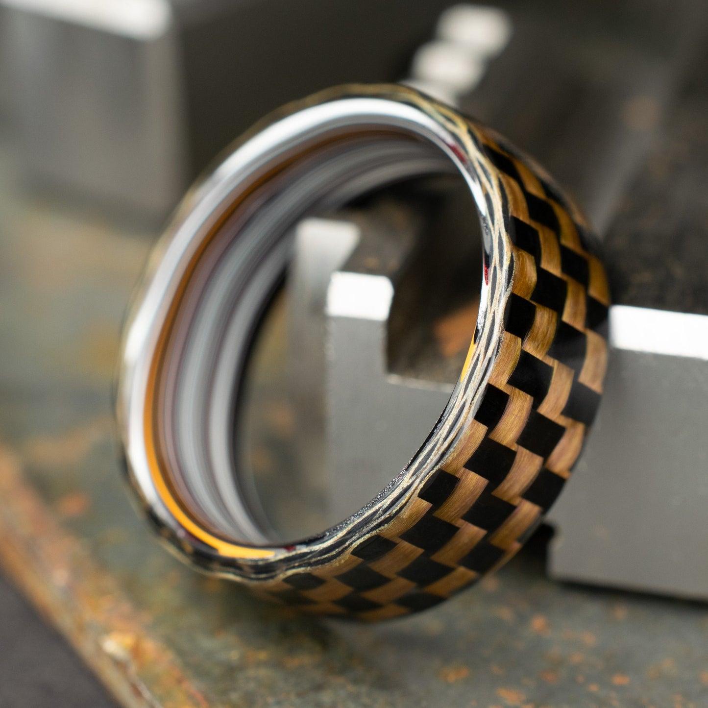 Checkered Zylon/Carbon Fiber Ring Lined With Straight Cut Fordite. Gloss Finish Zylon/Carbon Fiber. Men's Wedding Band.