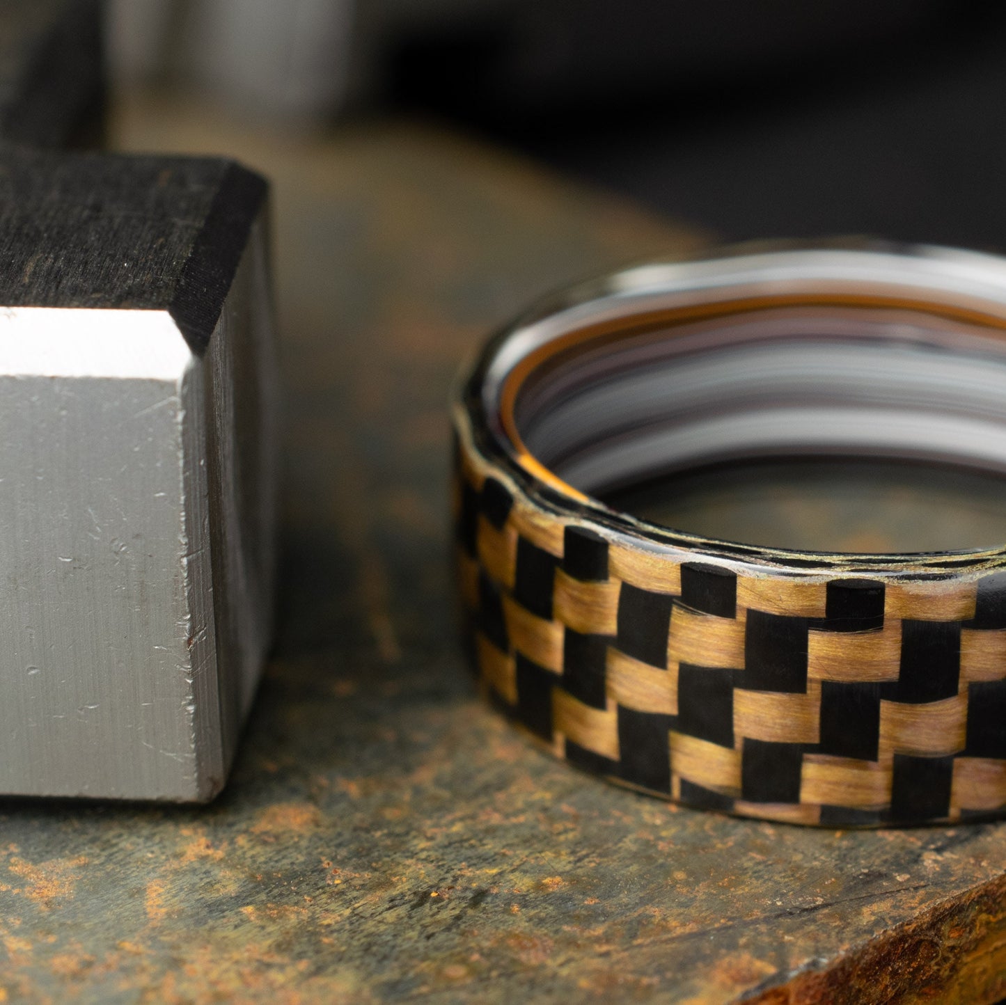 Checkered Zylon/Carbon Fiber Ring Lined With Straight Cut Fordite. Gloss Finish Zylon/Carbon Fiber. Men's Wedding Band.