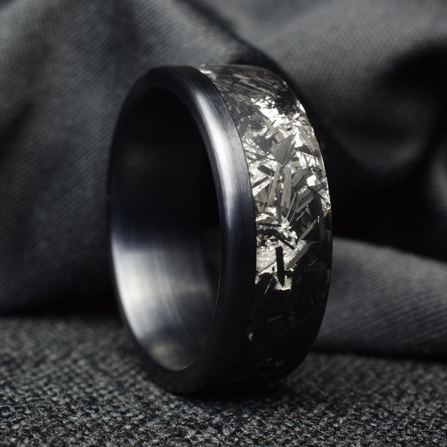 Matte Platinum Leaf Carbon Fiber Ring: Brushed Black Titanium Cuff.