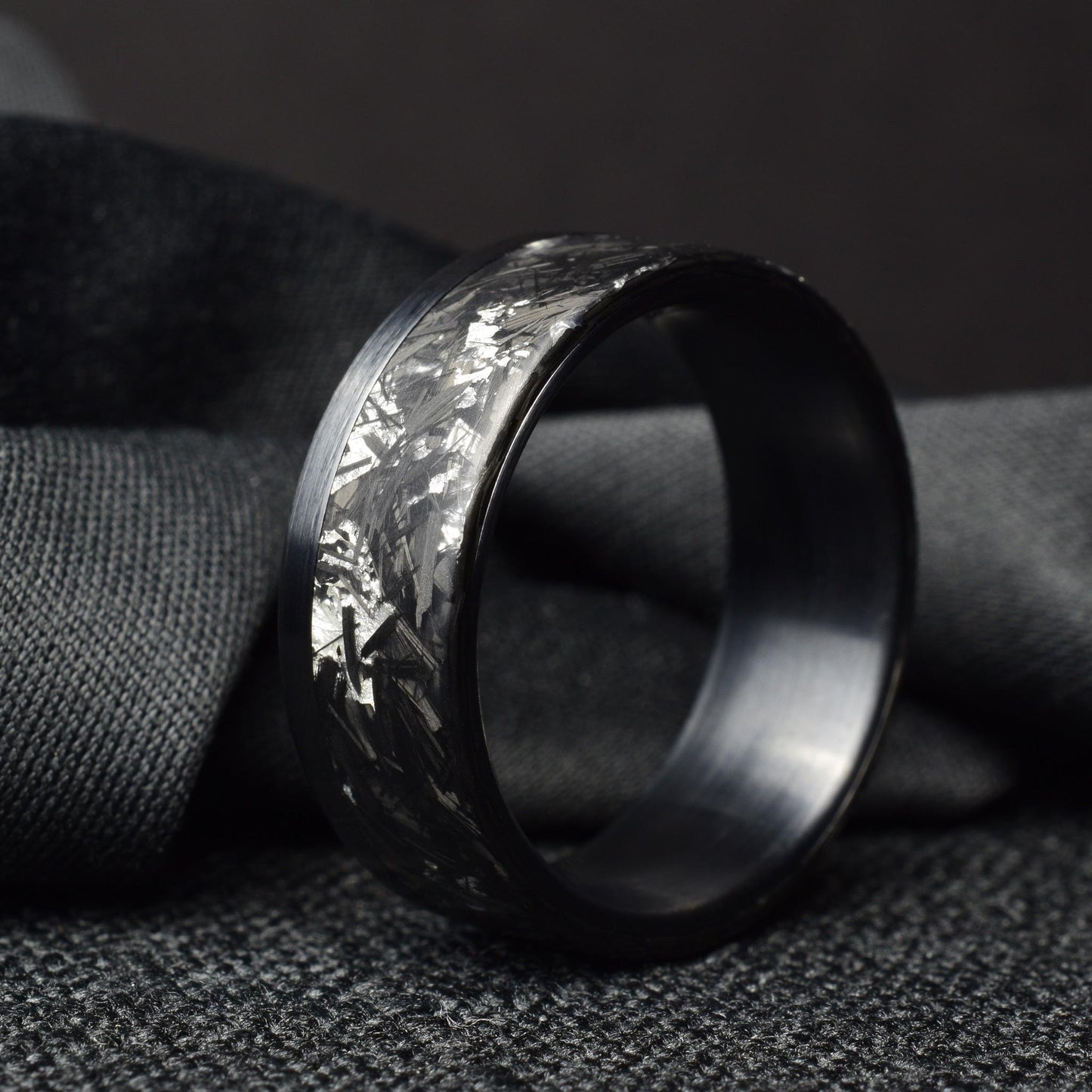 Matte Platinum Leaf Carbon Fiber Ring: Brushed Black Titanium Cuff.