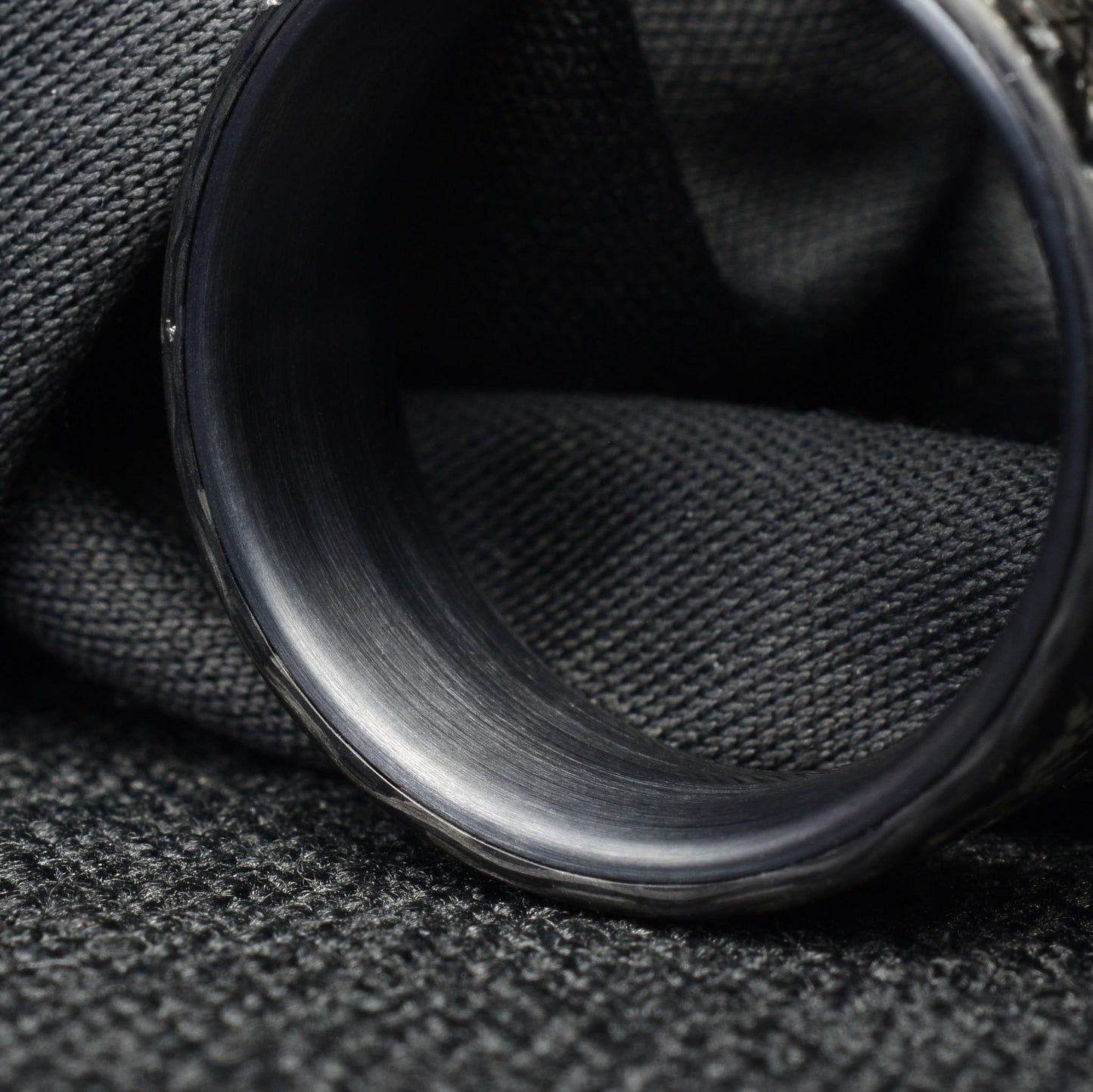 Matte Platinum Leaf Carbon Fiber Ring: Brushed Black Titanium Cuff.