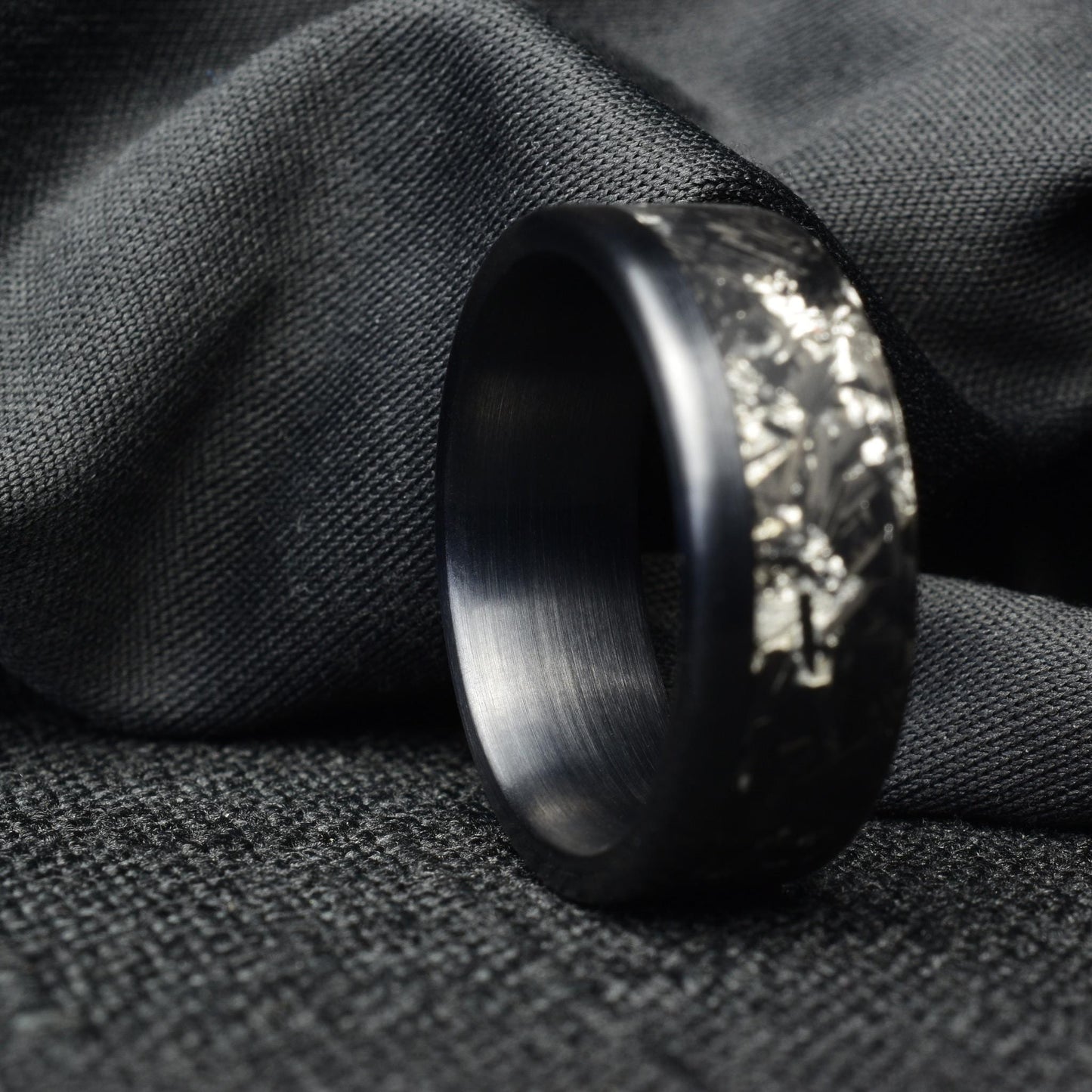Matte Platinum Leaf Carbon Fiber Ring: Brushed Black Titanium Cuff.