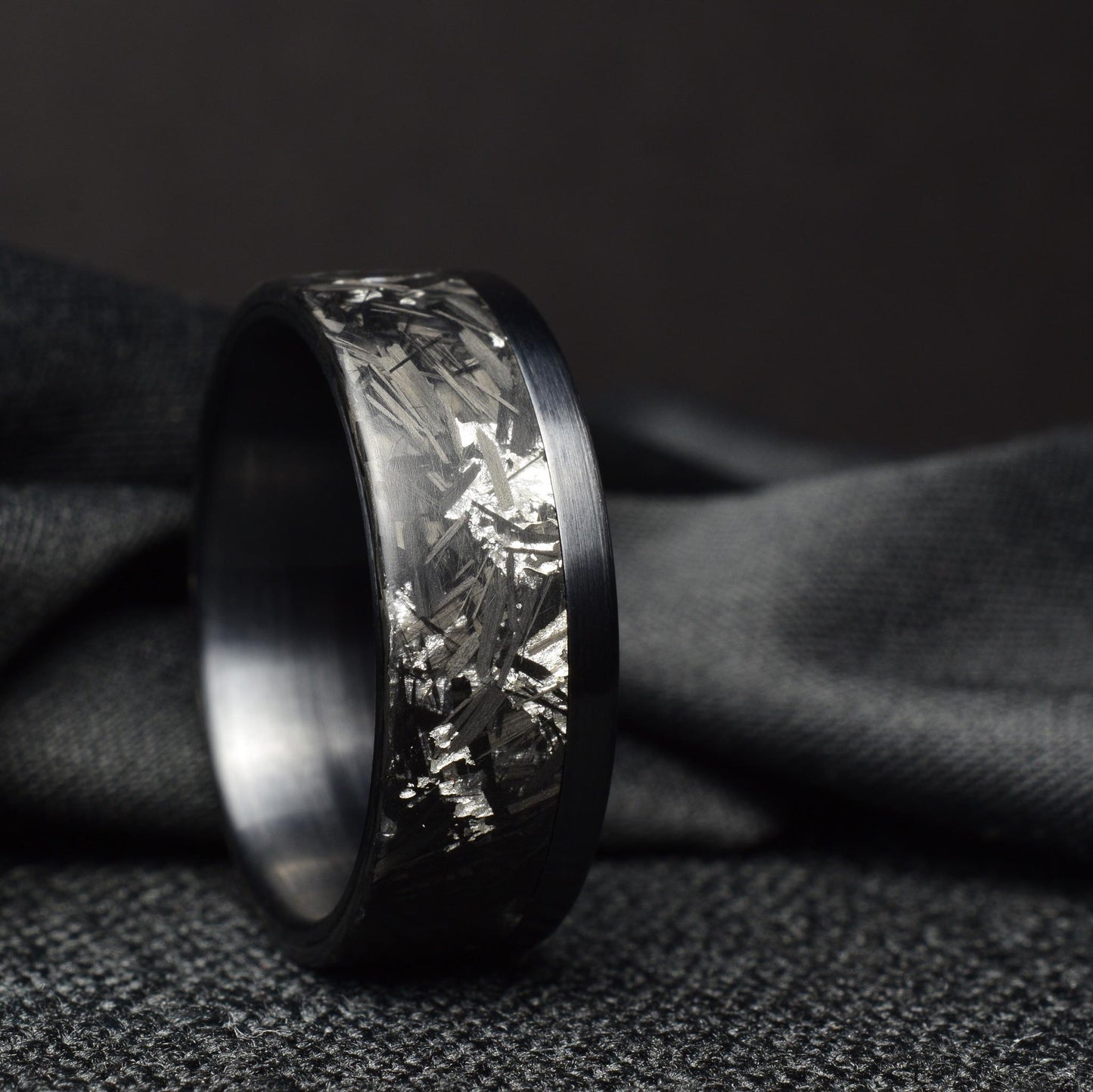 Matte Platinum Leaf Carbon Fiber Ring: Brushed Black Titanium Cuff.