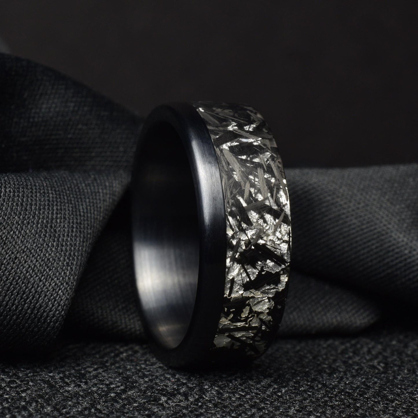 Matte Platinum Leaf Carbon Fiber Ring: Brushed Black Titanium Cuff.