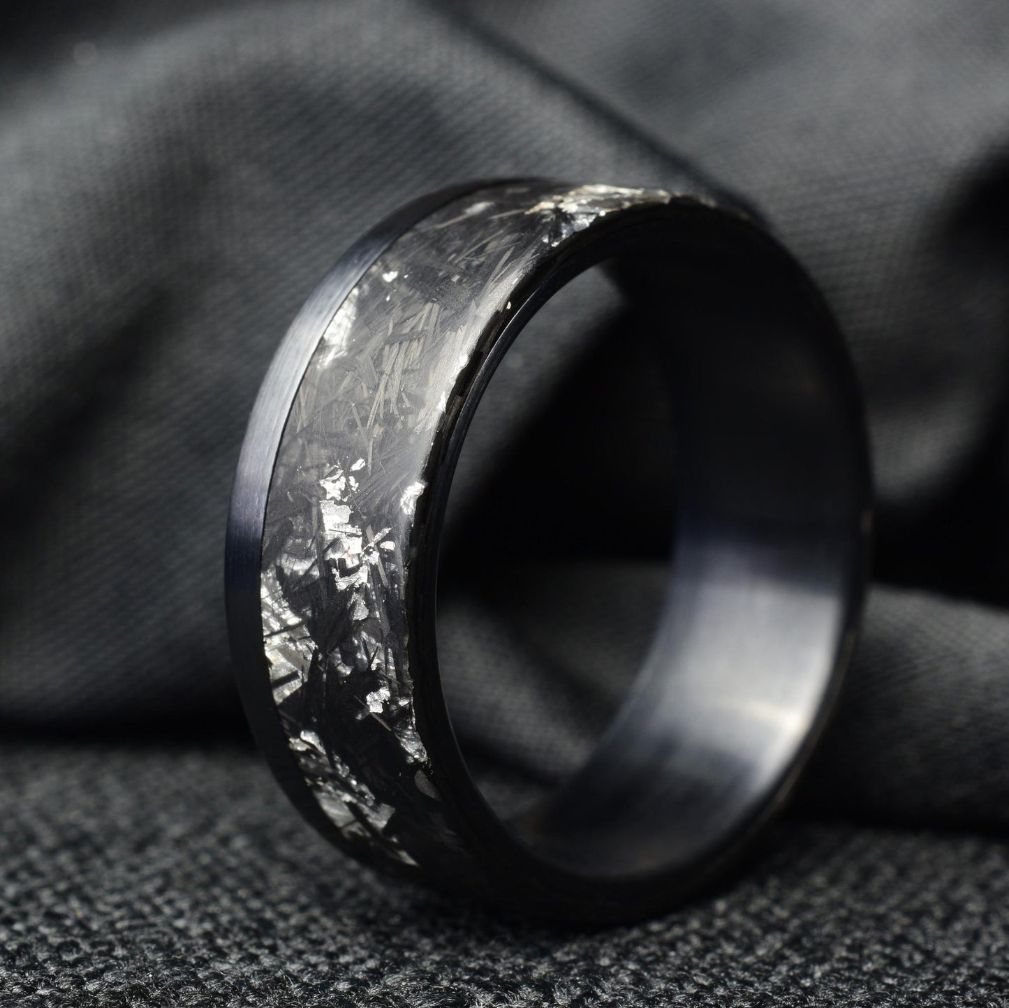 Matte Platinum Leaf Carbon Fiber Ring: Brushed Black Titanium Cuff.